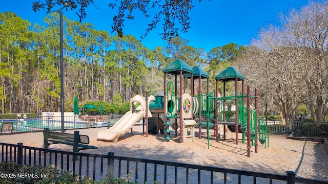 communal playground featuring fence