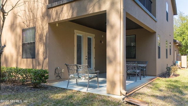 exterior space featuring a patio and stucco siding