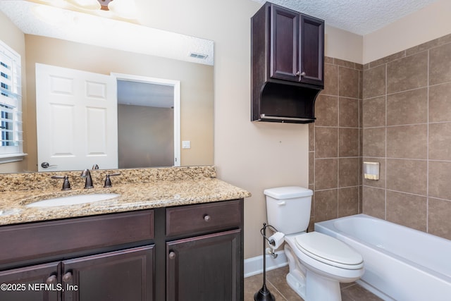 full bath featuring a textured ceiling, tile patterned flooring, toilet, vanity, and baseboards