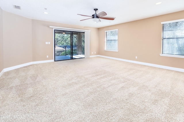 carpeted empty room with recessed lighting, visible vents, ceiling fan, and baseboards