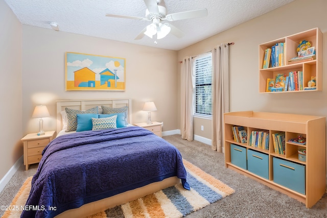 bedroom featuring carpet floors, ceiling fan, baseboards, and a textured ceiling