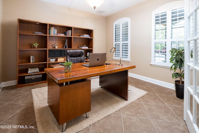 tiled office space with baseboards