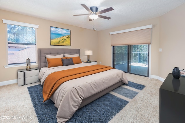 bedroom with baseboards, ceiling fan, carpet, access to outside, and a textured ceiling