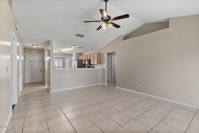 unfurnished living room with light tile patterned floors, lofted ceiling, visible vents, ceiling fan, and baseboards