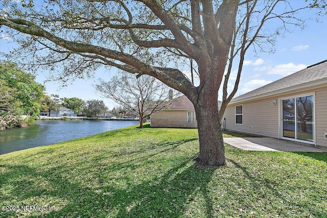 view of yard featuring a patio and a water view