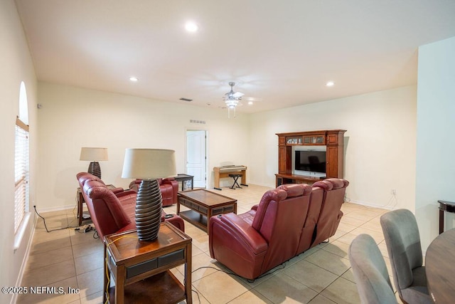 living room with a ceiling fan, recessed lighting, visible vents, and light tile patterned floors