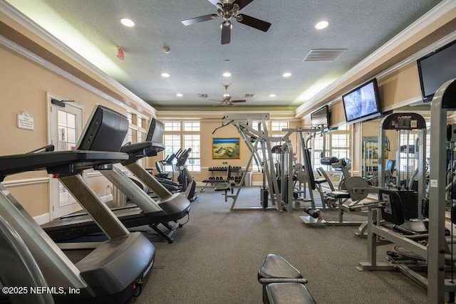 workout area featuring a textured ceiling, ceiling fan, recessed lighting, visible vents, and ornamental molding