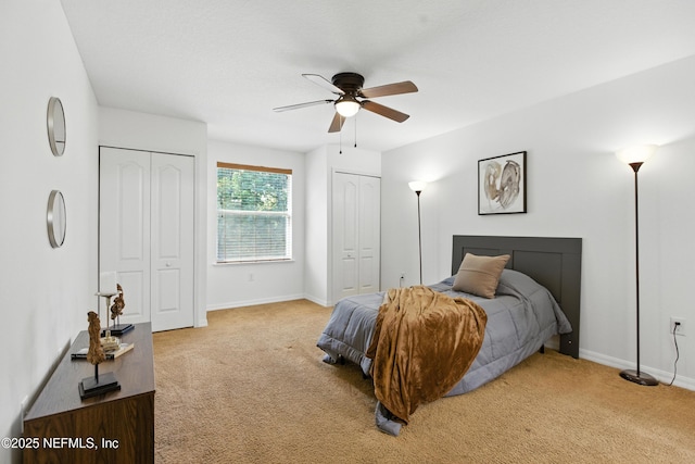 75250 Fern Creek Dr, Yulee, FL 32097 - bedroom featuring light colored carpet, multiple closets, and ceiling fan