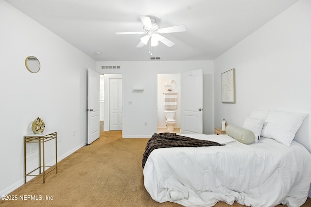 75250 Fern Creek Dr, Yulee, FL 32097 - bedroom featuring light colored carpet, ensuite bath, and a ceiling fan