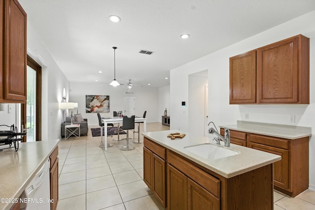 75250 Fern Creek Dr, Yulee, FL 32097 - kitchen featuring dishwasher, open floor plan, light tile patterned floors, brown cabinets, and recessed lighting