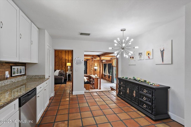 kitchen featuring dishwasher, light tile patterned flooring, visible vents, and white cabinets