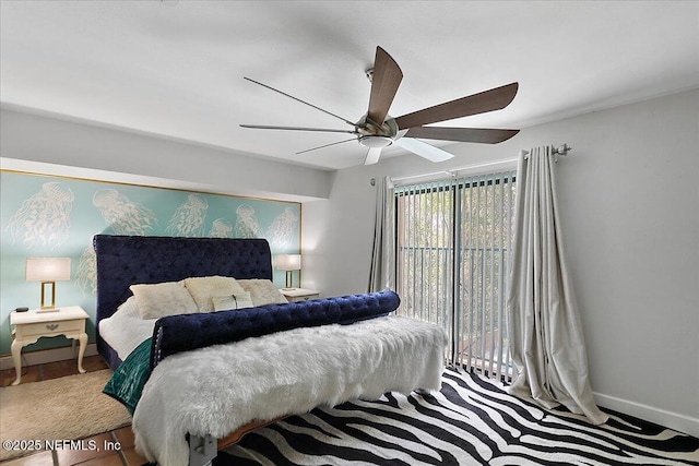 bedroom with a ceiling fan and baseboards