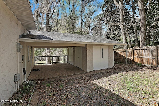 view of outdoor structure featuring fence