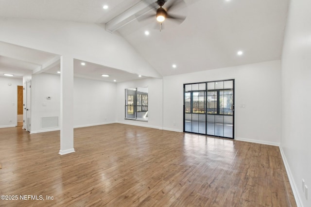 unfurnished living room featuring baseboards, beam ceiling, a ceiling fan, and wood finished floors