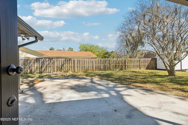 view of patio / terrace featuring fence