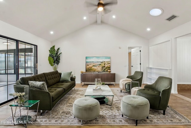 living room featuring wood finished floors, visible vents, baseboards, a ceiling fan, and beamed ceiling