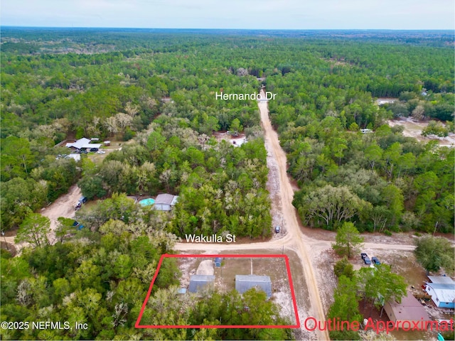 bird's eye view featuring a forest view