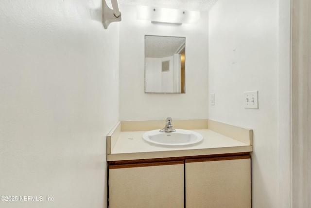 bathroom featuring visible vents and vanity