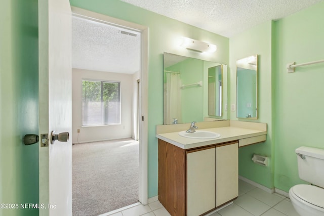 bathroom featuring a textured ceiling, toilet, vanity, baseboards, and a shower with curtain