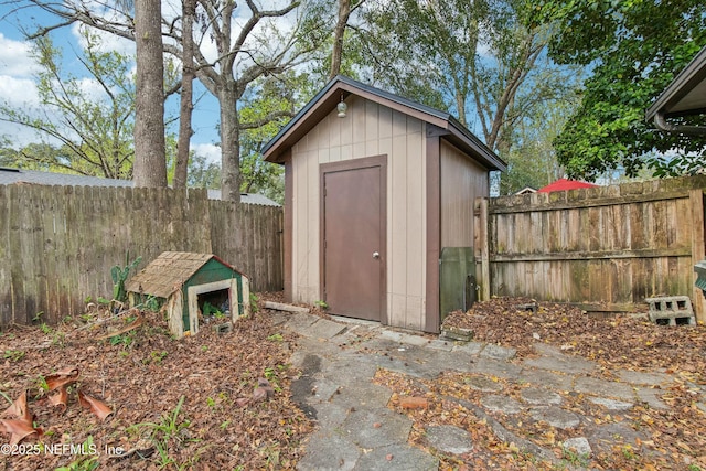 view of shed featuring a fenced backyard