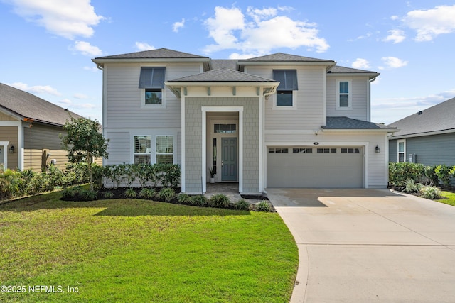 view of front of home featuring concrete driveway, a garage, and a front lawn