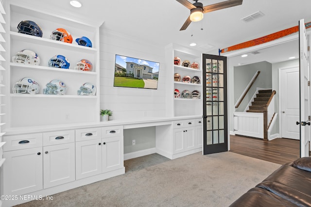 carpeted office with visible vents, recessed lighting, baseboards, ceiling fan, and built in study area