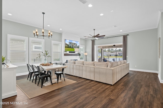 living area with dark wood-style floors, baseboards, and ornamental molding