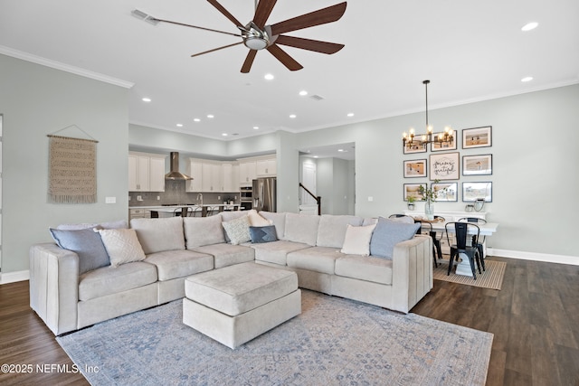 living area with dark wood finished floors, baseboards, and ornamental molding