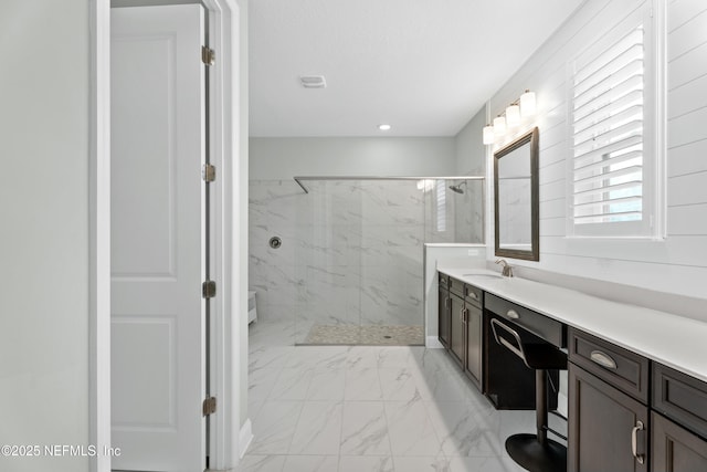 bathroom with a marble finish shower, marble finish floor, vanity, and toilet