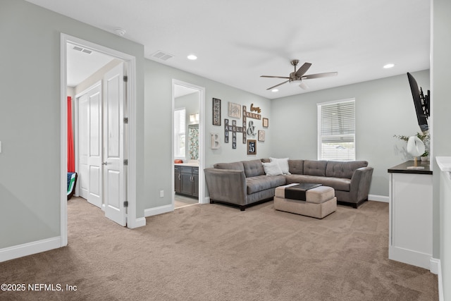 living area featuring a ceiling fan, visible vents, baseboards, carpet floors, and recessed lighting