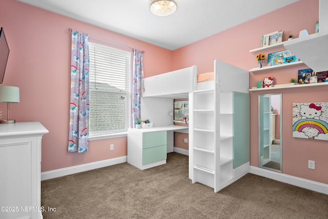 bedroom with baseboards and carpet