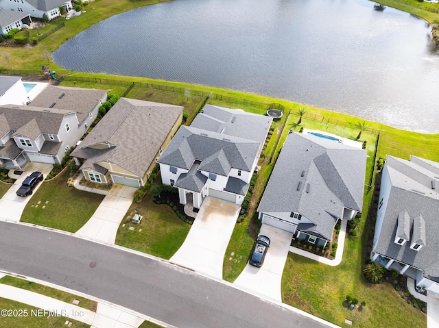 birds eye view of property featuring a residential view and a water view