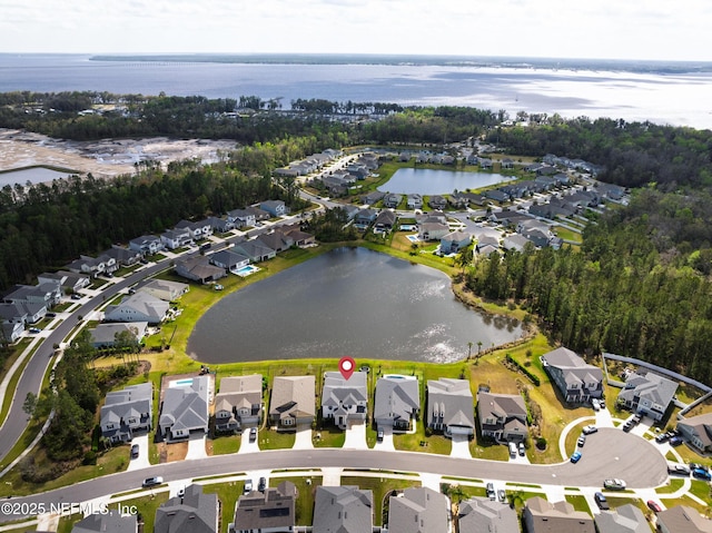 birds eye view of property featuring a residential view and a water view