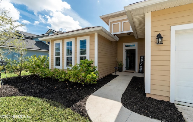 property entrance featuring a garage