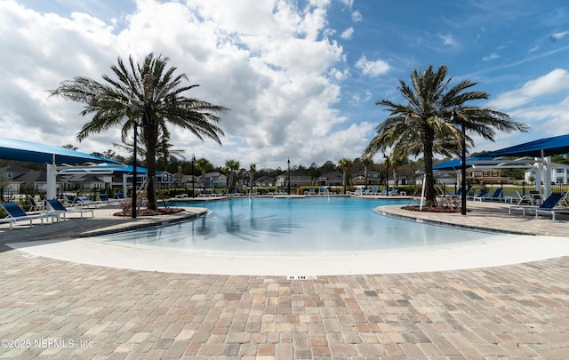 community pool with a patio