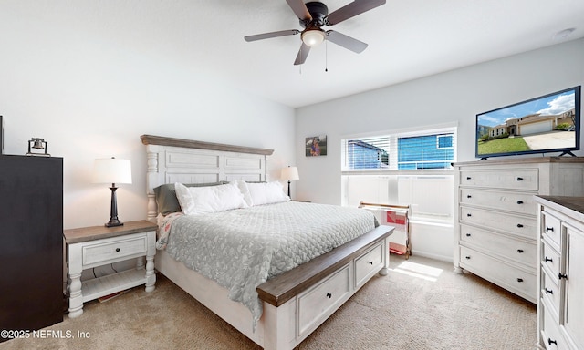 bedroom with light carpet and ceiling fan