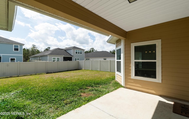 view of yard with a patio area and a fenced backyard