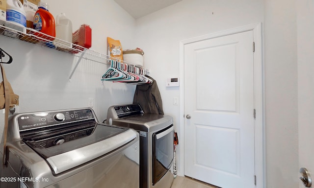 laundry area featuring laundry area and washing machine and clothes dryer