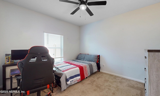 bedroom with ceiling fan, carpet flooring, and baseboards