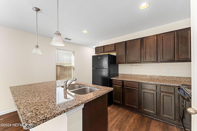 8120 Dandy Ave, Jacksonville, FL 32211 - kitchen with dark wood-style flooring, visible vents, a sink, dark brown cabinetry, and black appliances