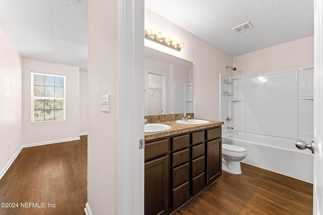 8120 Dandy Ave, Jacksonville, FL 32211 - full bathroom featuring a sink, a textured ceiling, visible vents, and wood finished floors