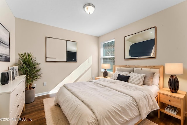 8120 Dandy Ave, Jacksonville, FL 32211 - bedroom with dark wood-type flooring and baseboards