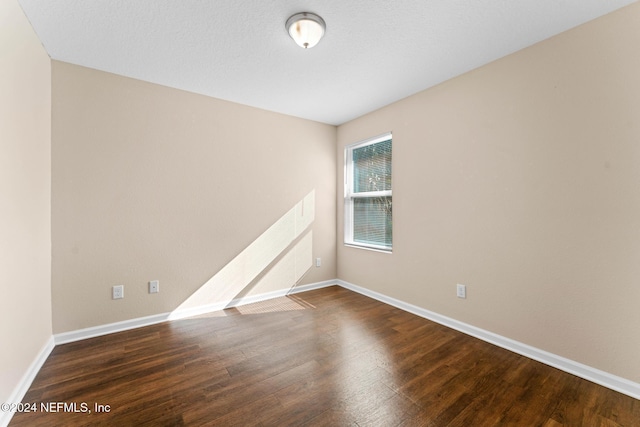 8120 Dandy Ave, Jacksonville, FL 32211 - empty room with wood finished floors and baseboards