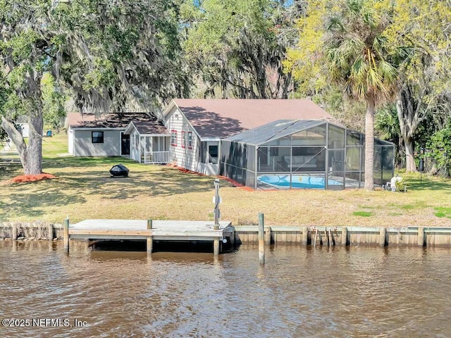 dock area with a water view and a yard