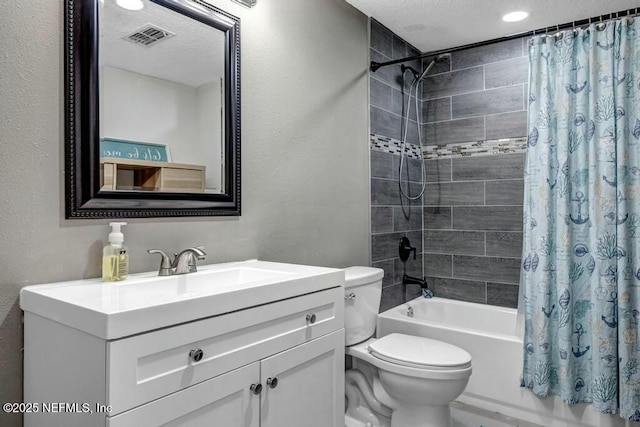 bathroom featuring a textured ceiling, toilet, shower / bath combo, and visible vents