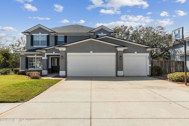 traditional home featuring a garage, concrete driveway, stucco siding, fence, and a front yard