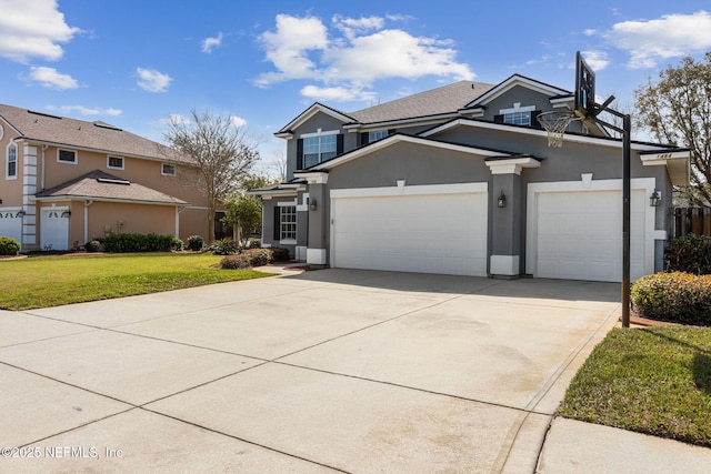 view of front of property featuring a garage, a front yard, concrete driveway, and stucco siding