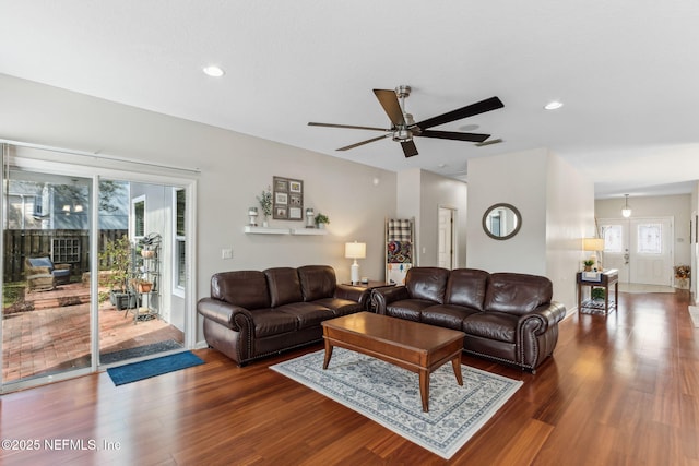 living room featuring wood finished floors, a ceiling fan, and recessed lighting