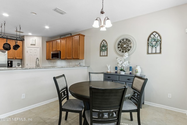 dining room featuring light tile patterned floors, a notable chandelier, recessed lighting, visible vents, and baseboards