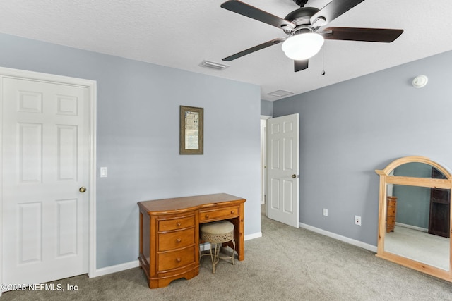 office with baseboards, visible vents, and carpet flooring